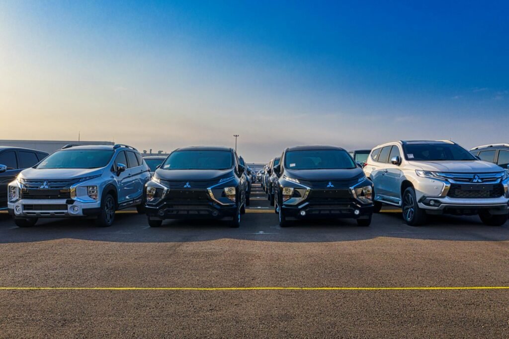 Multiple SUVs parked outdoors under a clear blue sky. Modern and sleek automotive design.