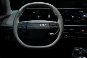 Close-up view of the Kia EV's steering wheel showcasing its modern design and technology.