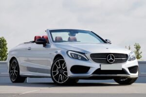 Sleek Mercedes convertible parked outdoors, showcasing luxury design and elegance.